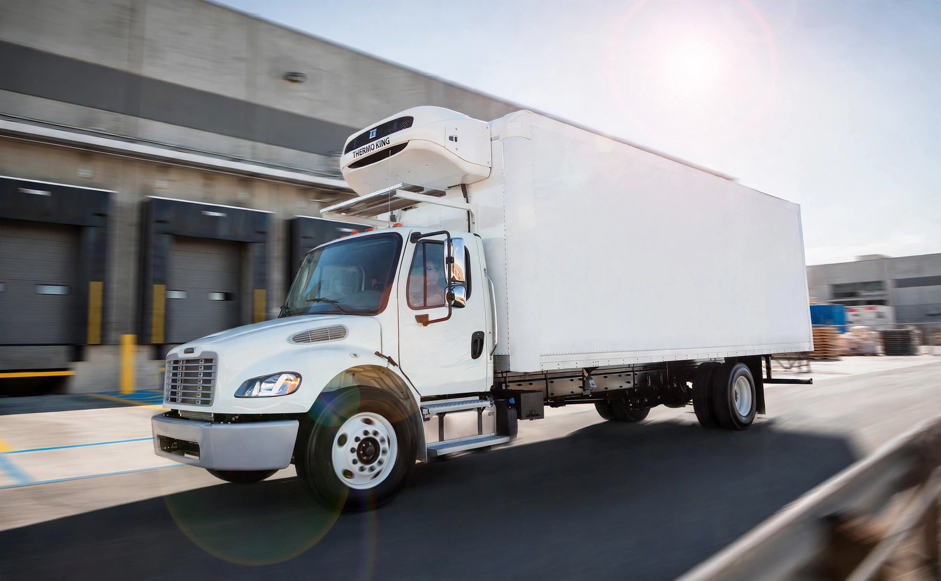 Evermount refrigerated truck body at a warehouse loading dock